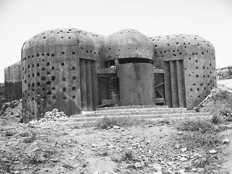 Concrete emplacement for mobile 150-mm gun used by the Germans in their coastal defenses at Equerdreville, France. September 4, 1944