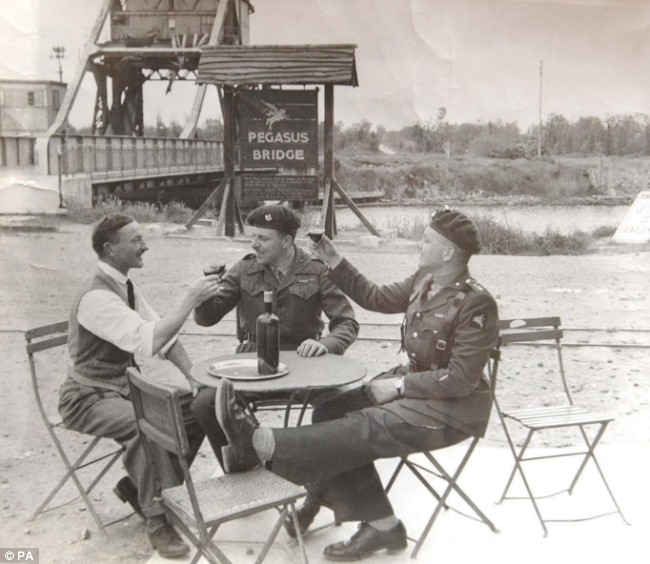 The bridge can be seen in the background of this 1946 picture. On the right is Capt David Wood with Major John Howard DSO, who led the attack, and Georges Gondree, the owner of Cafe Gondree - now the Pegasus Bridge Cafe