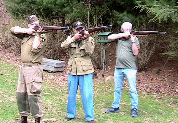 Shifty Powers (center) firing his newly refinished M1 Garand at his home in Virginia with Jim Radel (left) and Dennis Chapin (right). Powers was considered the best shot in his unit during WWII.