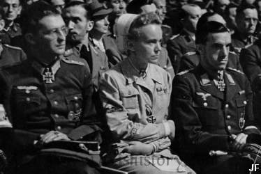 DRK nurse Ilse Schulz wearing the Iron Cross and Afrika Korps cufftitle flanked by two Knight's Cross holders